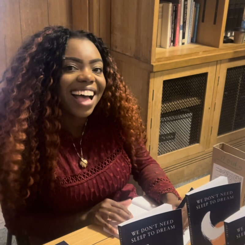 Ovyuki signing her books We Don't Need Sleep to Dream at Southwark Cathedral 2024 Togetherness Poetry Challenge Celebration Event
